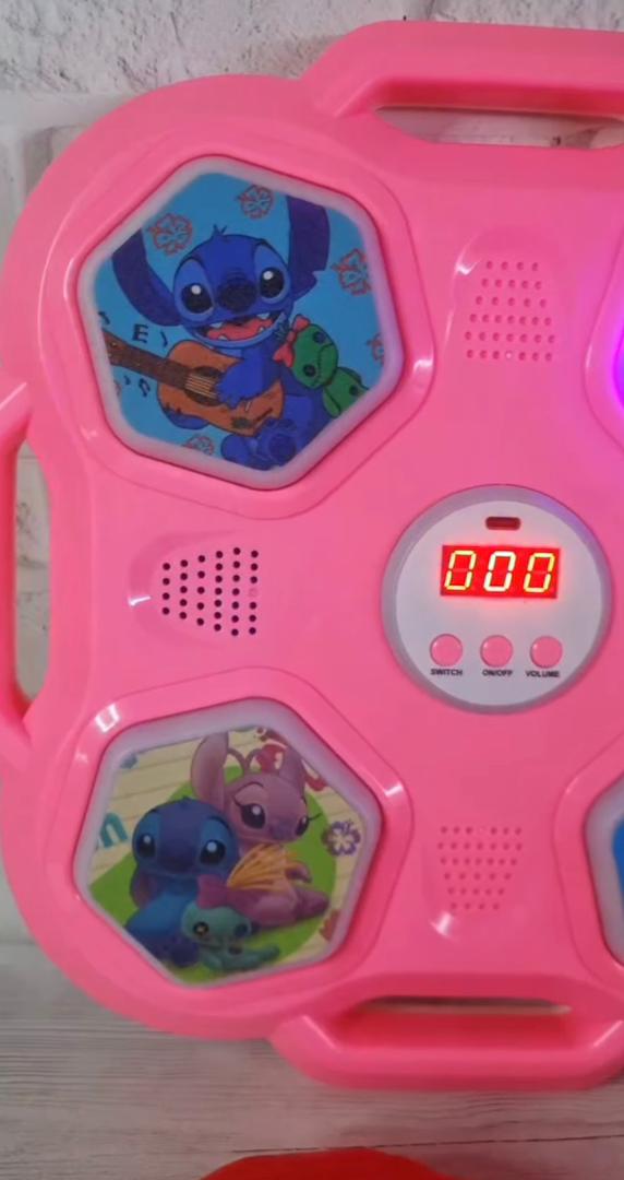 Machine de boxe musicale Stitch, rose