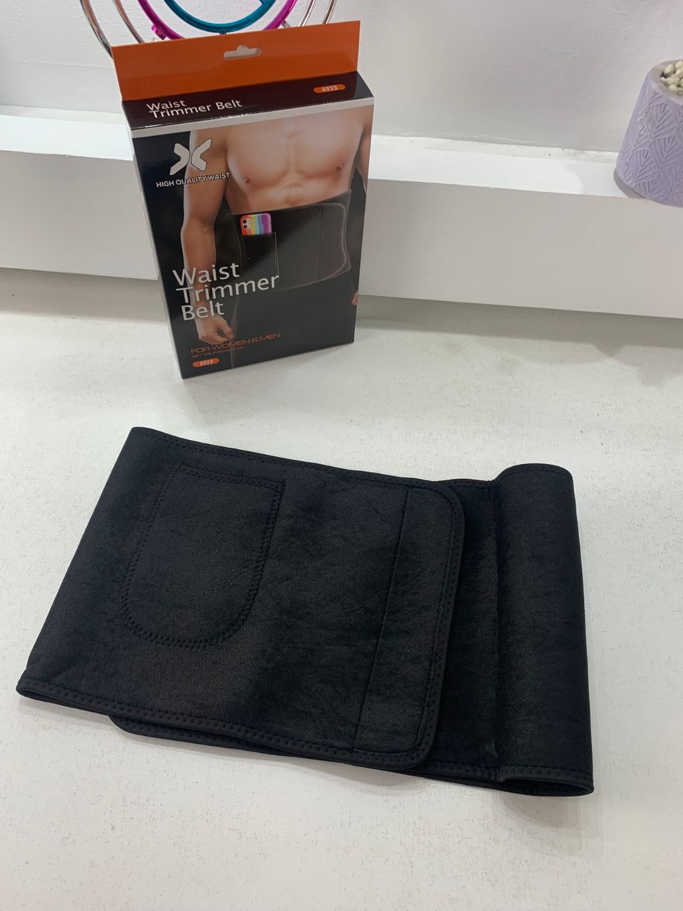 Unisex sweat belt with outer pocket