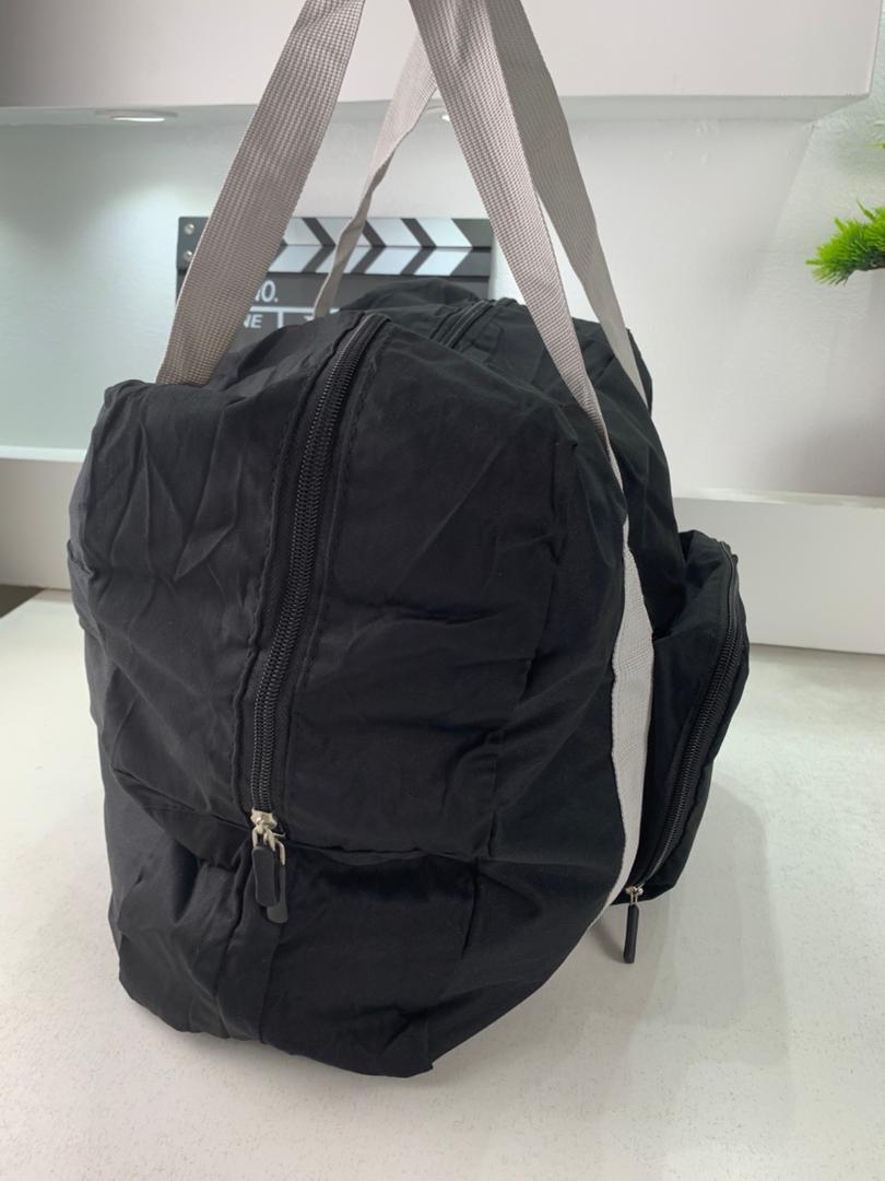 Foldable travel bag 23 L with luggage strap