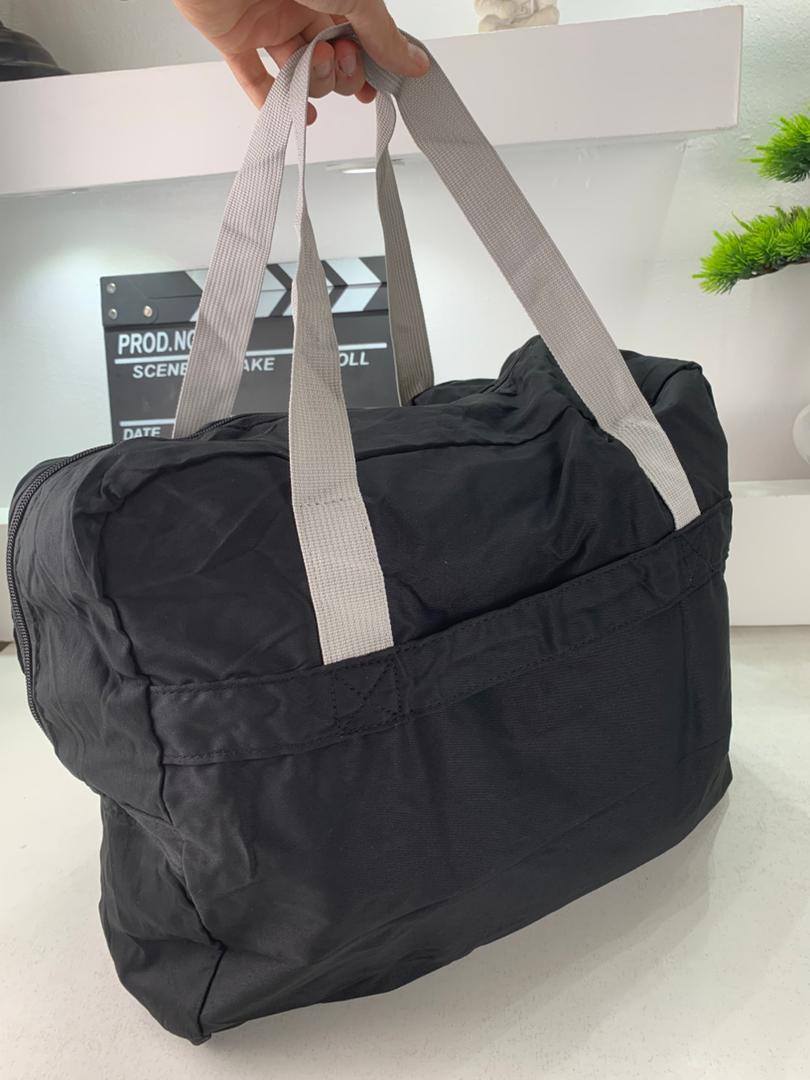 Foldable travel bag 23 L with luggage strap